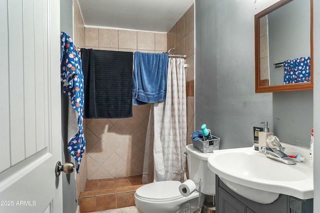 bathroom featuring vanity, toilet, and walk in shower