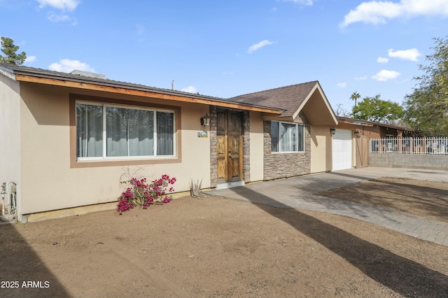 single story home with a garage