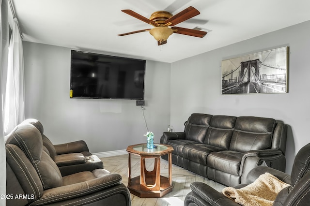 living room featuring ceiling fan and light parquet flooring