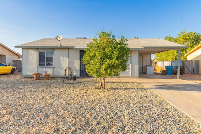 6960 W Berkeley Rd, Phoenix, AZ 85035 - view of front of home featuring a carport, concrete driveway, fence, and a gate