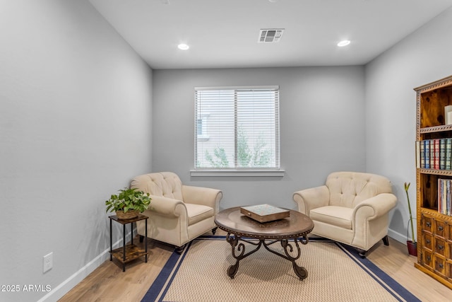 sitting room featuring light hardwood / wood-style flooring