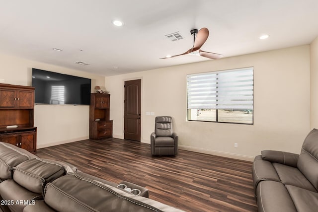 living room with baseboards, dark wood-style flooring, visible vents, and recessed lighting