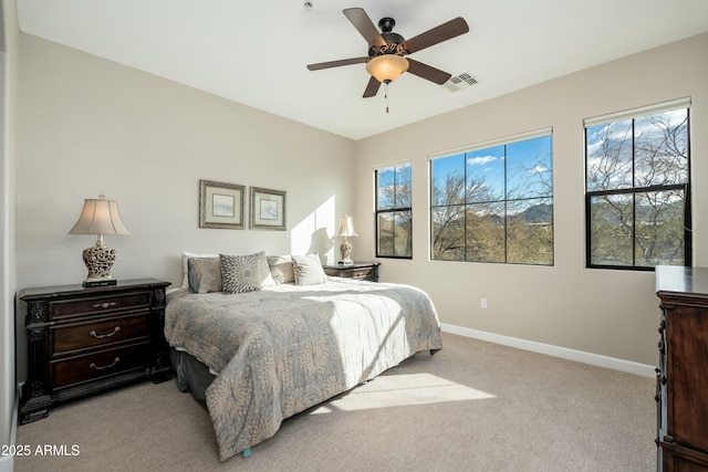 bedroom featuring visible vents, ceiling fan, light carpet, and baseboards