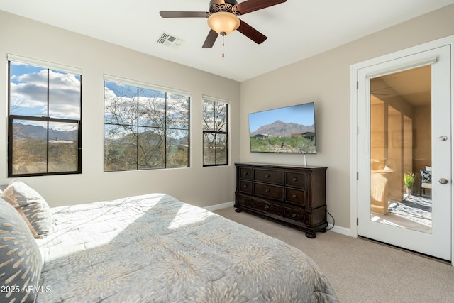 bedroom with carpet floors, visible vents, baseboards, and a ceiling fan