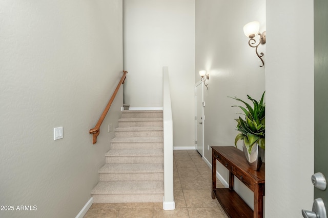 stairs with tile patterned flooring and baseboards