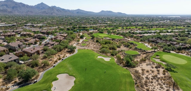 bird's eye view featuring view of golf course and a mountain view