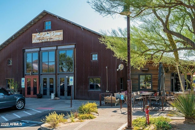 view of building exterior featuring uncovered parking