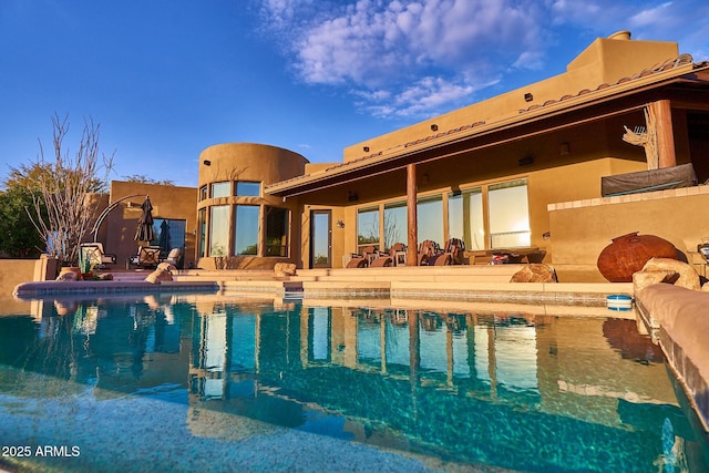 view of swimming pool featuring a patio