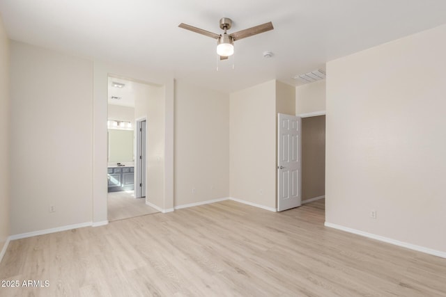 unfurnished room featuring ceiling fan and light hardwood / wood-style floors