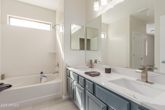 bathroom featuring vanity and shower / washtub combination