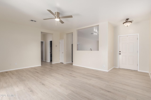 spare room with light hardwood / wood-style flooring and ceiling fan