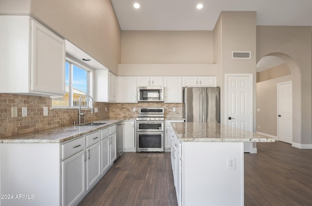 kitchen with white cabinetry, sink, dark hardwood / wood-style floors, and stainless steel appliances