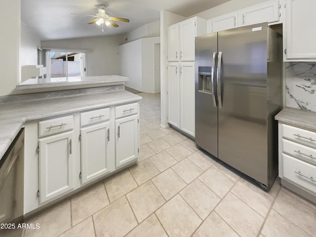 kitchen with tasteful backsplash, stainless steel appliances, ceiling fan, white cabinetry, and light tile patterned flooring