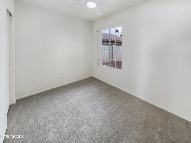 spare room with carpet flooring and ceiling fan