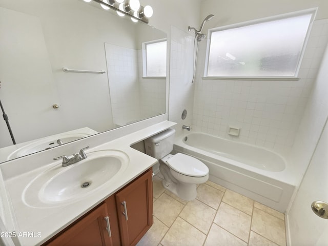 full bathroom with tile patterned flooring, vanity, toilet, and tiled shower / bath