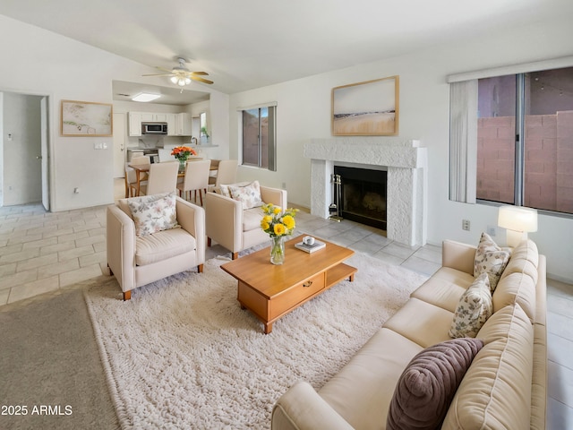 living room featuring ceiling fan and light tile patterned floors