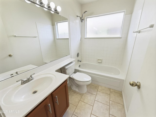 full bathroom featuring tile patterned floors, vanity, toilet, and tiled shower / bath