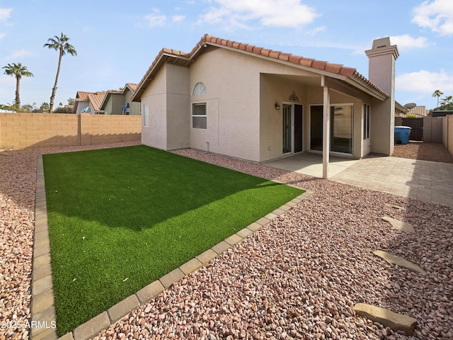 back of property with a patio area