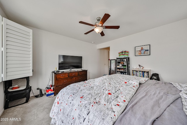 carpeted bedroom featuring a ceiling fan
