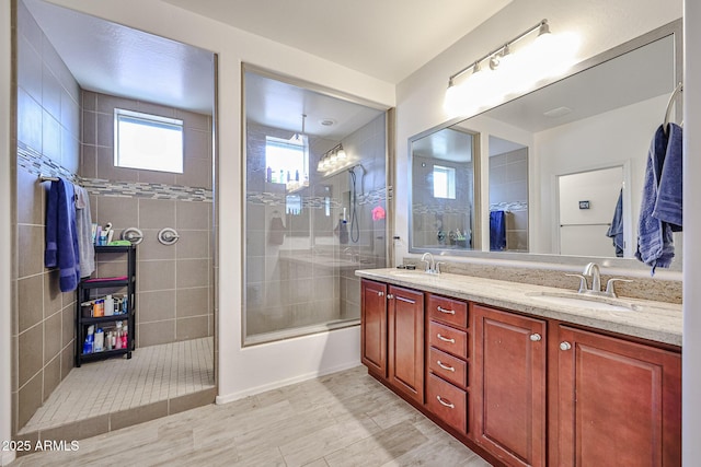 full bathroom with a sink and double vanity