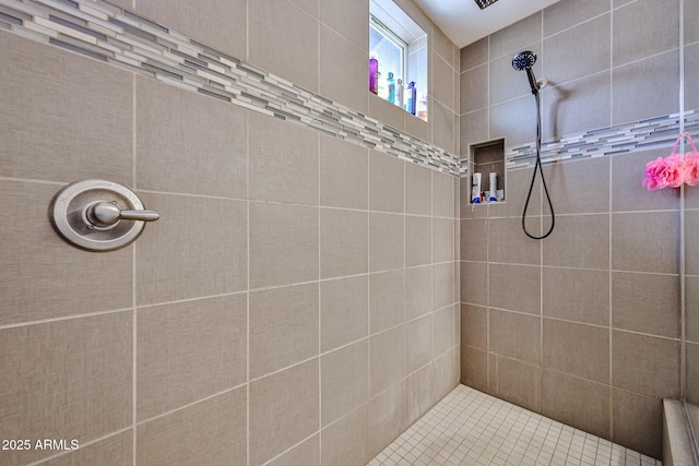 full bath featuring a tile shower