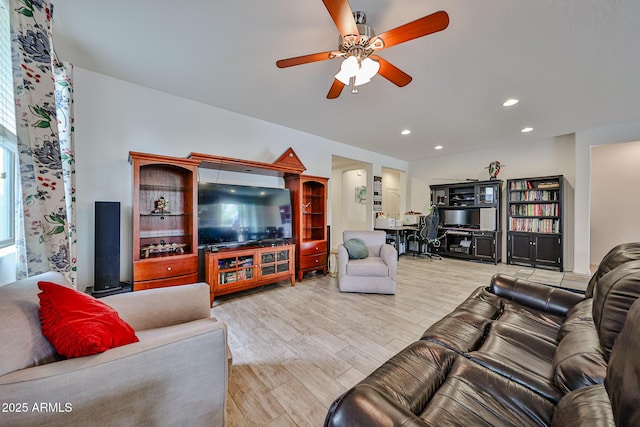 living room with recessed lighting, light wood finished floors, and ceiling fan