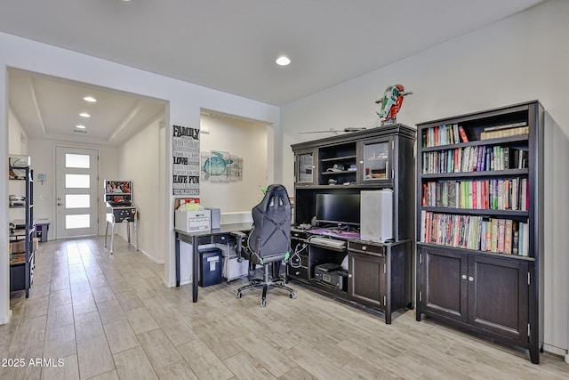 office featuring baseboards, recessed lighting, and light wood-type flooring