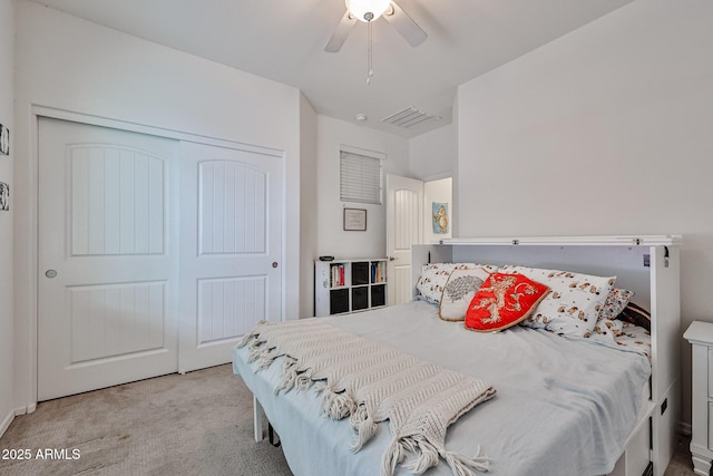 bedroom featuring ceiling fan, carpet flooring, a closet, and visible vents