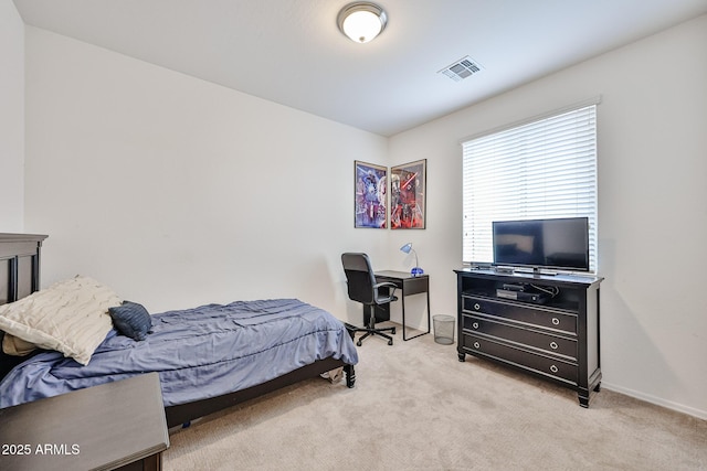 bedroom with light colored carpet, baseboards, and visible vents