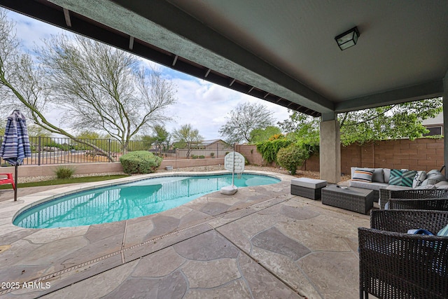 view of swimming pool featuring a patio area, a fenced in pool, outdoor lounge area, and a fenced backyard