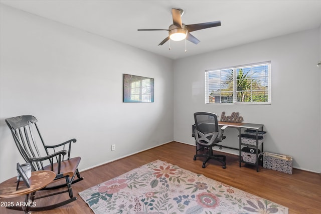 office space featuring plenty of natural light, a ceiling fan, and wood finished floors