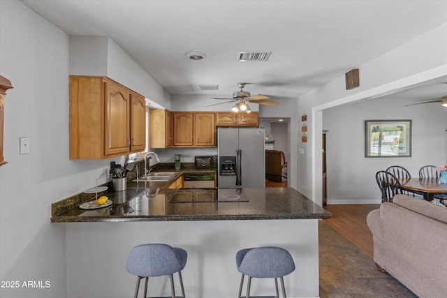 kitchen with visible vents, appliances with stainless steel finishes, ceiling fan, and a sink