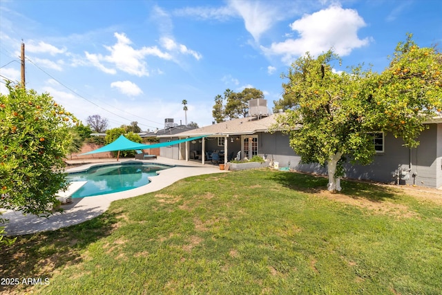 outdoor pool with a yard, a patio area, and fence private yard