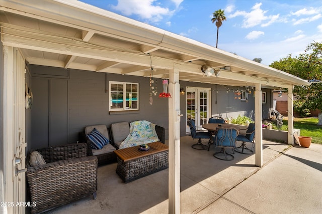 view of patio with an outdoor living space and french doors