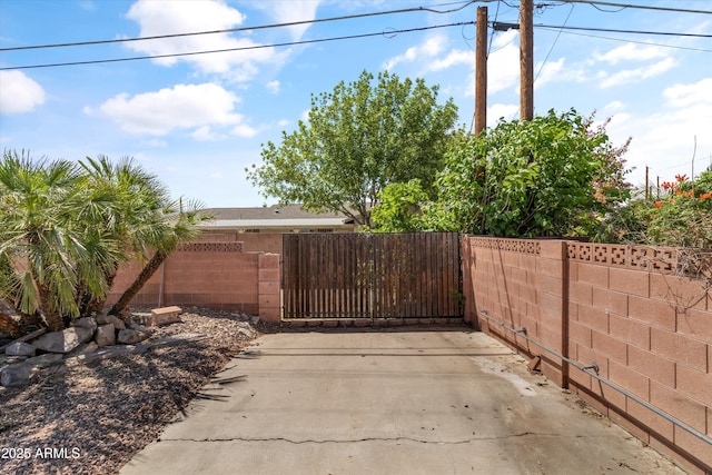 view of gate with fence