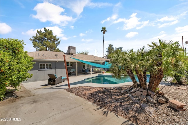pool with central air condition unit and a patio