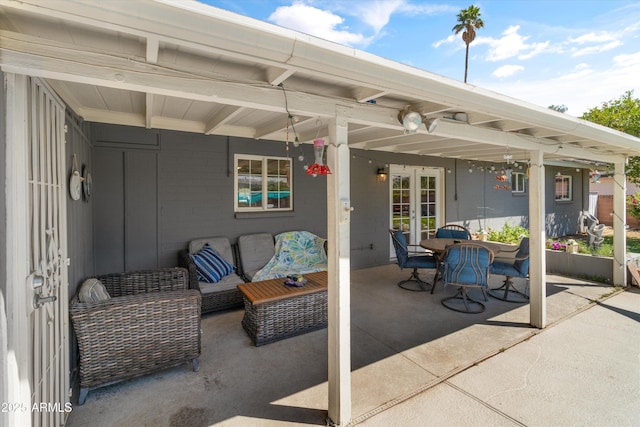 view of patio / terrace featuring an outdoor hangout area, french doors, and outdoor dining space