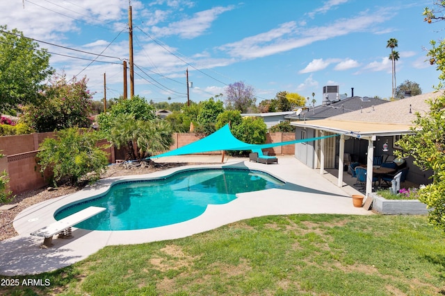 view of swimming pool with a fenced in pool, a fenced backyard, a yard, a diving board, and a patio area
