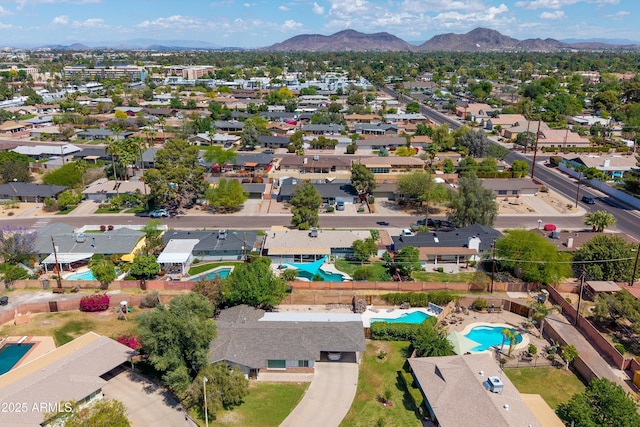birds eye view of property with a residential view and a mountain view