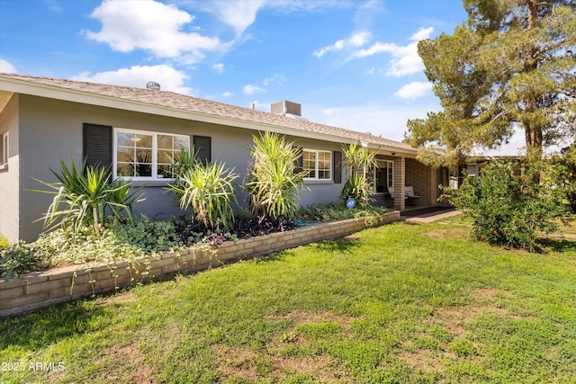 exterior space with a yard