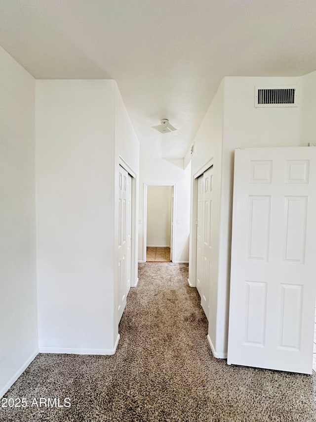 hall featuring carpet