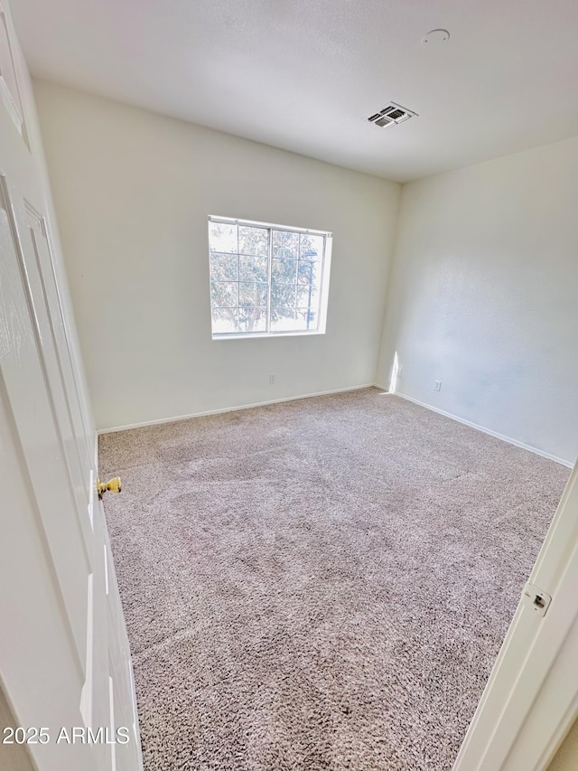 spare room with carpet flooring