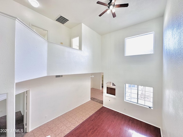 unfurnished room with ceiling fan