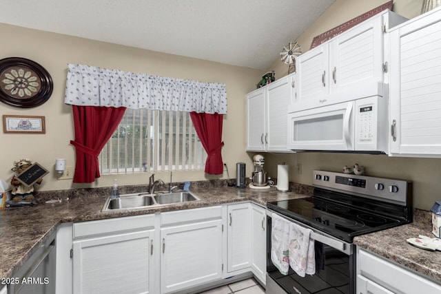 kitchen with sink, white cabinets, a textured ceiling, and electric stove