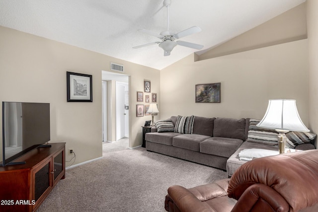 carpeted living room with vaulted ceiling and ceiling fan