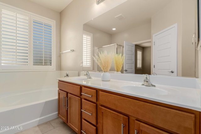 bathroom featuring vanity, tile patterned floors, and separate shower and tub