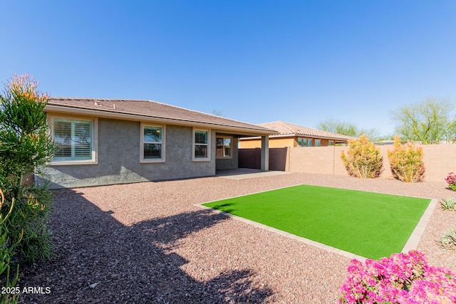 rear view of house with a patio