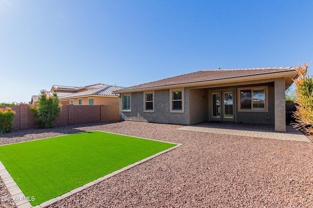 back of house featuring a patio