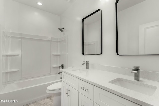 bathroom with toilet, double vanity, shower / washtub combination, and a sink