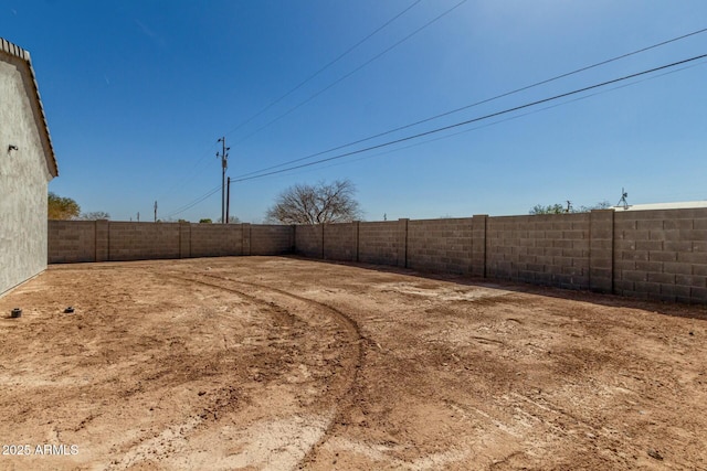 view of yard with a fenced backyard